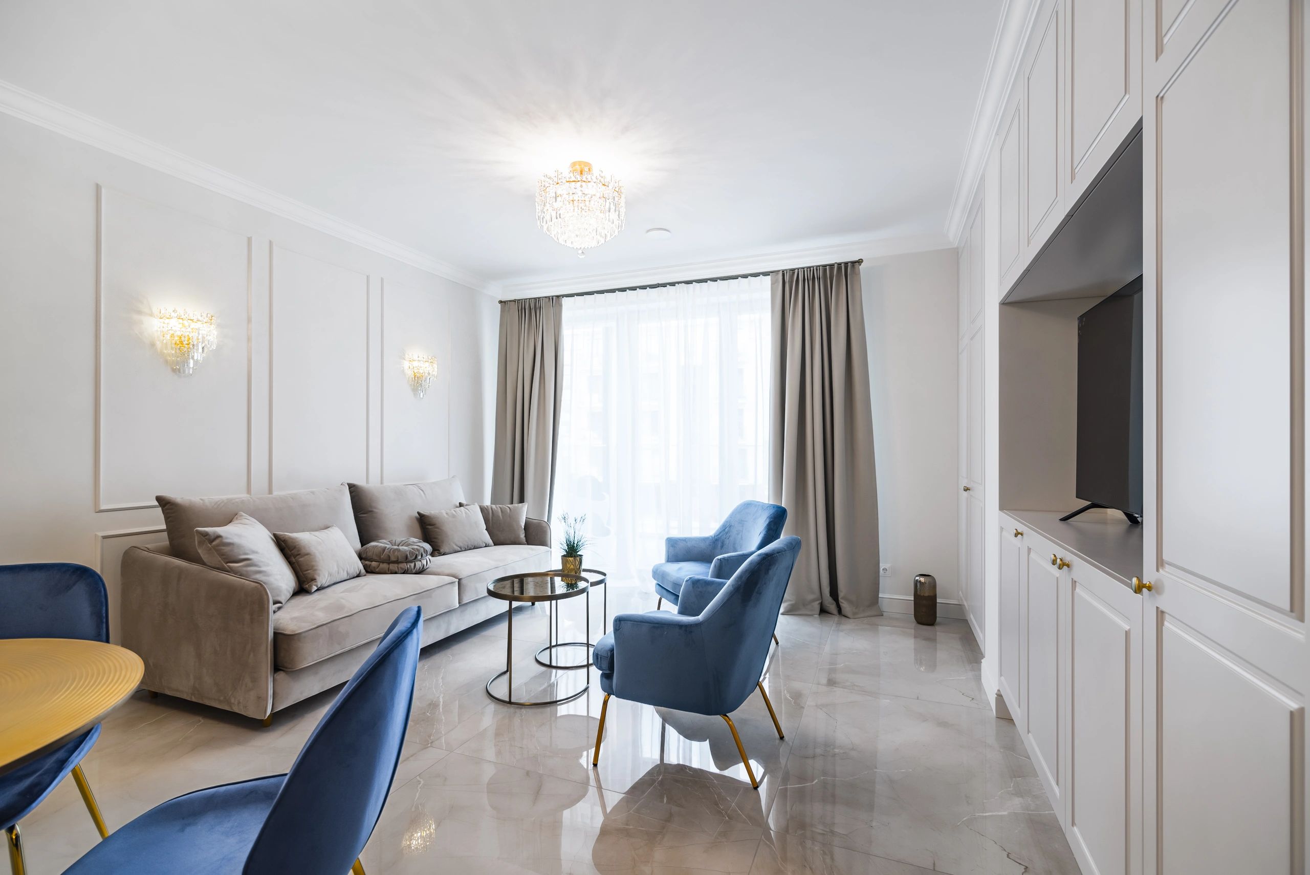 Modern luxury apartment living room with curated neutral palette