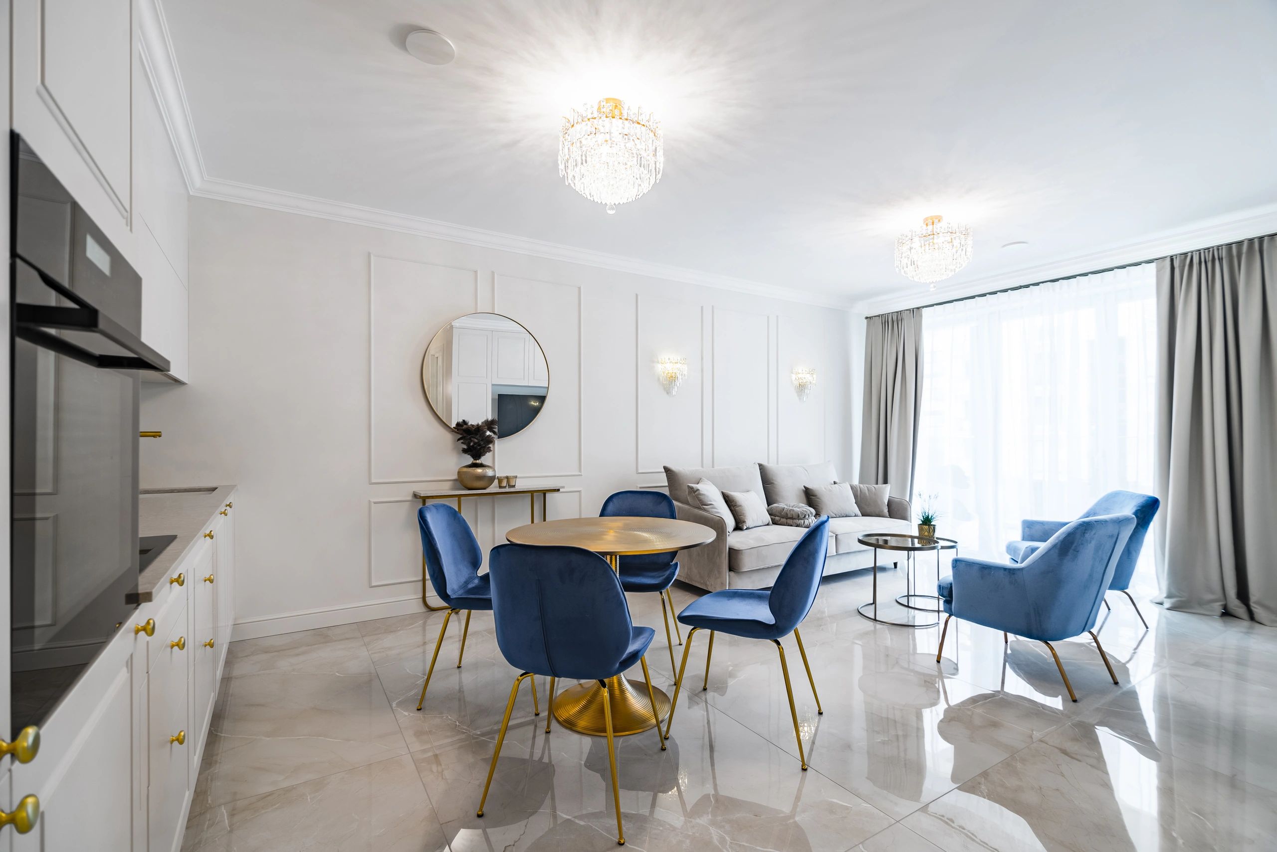 Open-plan modern apartment living area with connected kitchen