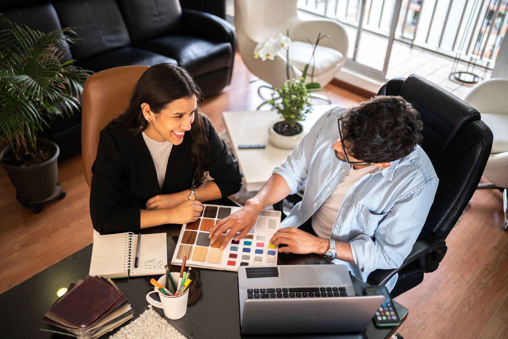 Architects reviewing plans together at a desk
