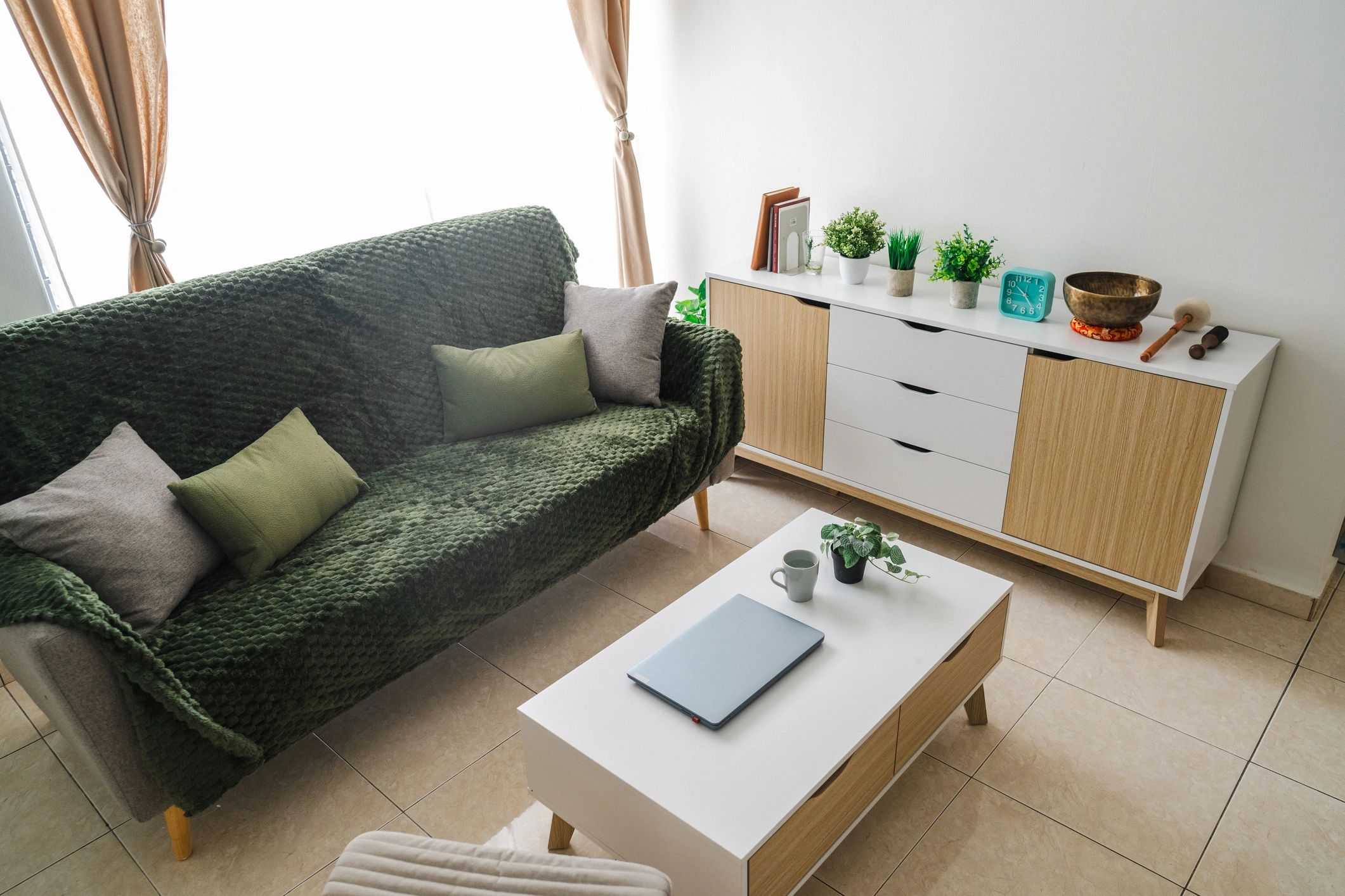 Minimal living room vignette representing a satisfied residential client